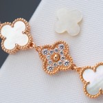 Van Cleef & Arpels watch with white mother-of-pearl and diamond-set clover dial